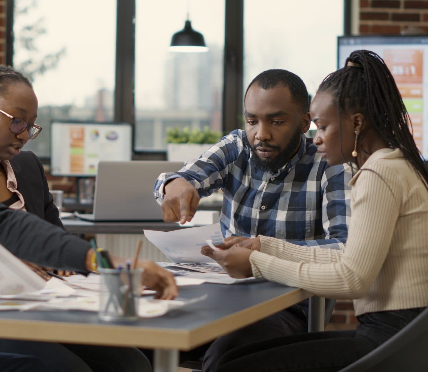 Two people reviewing financial documents together