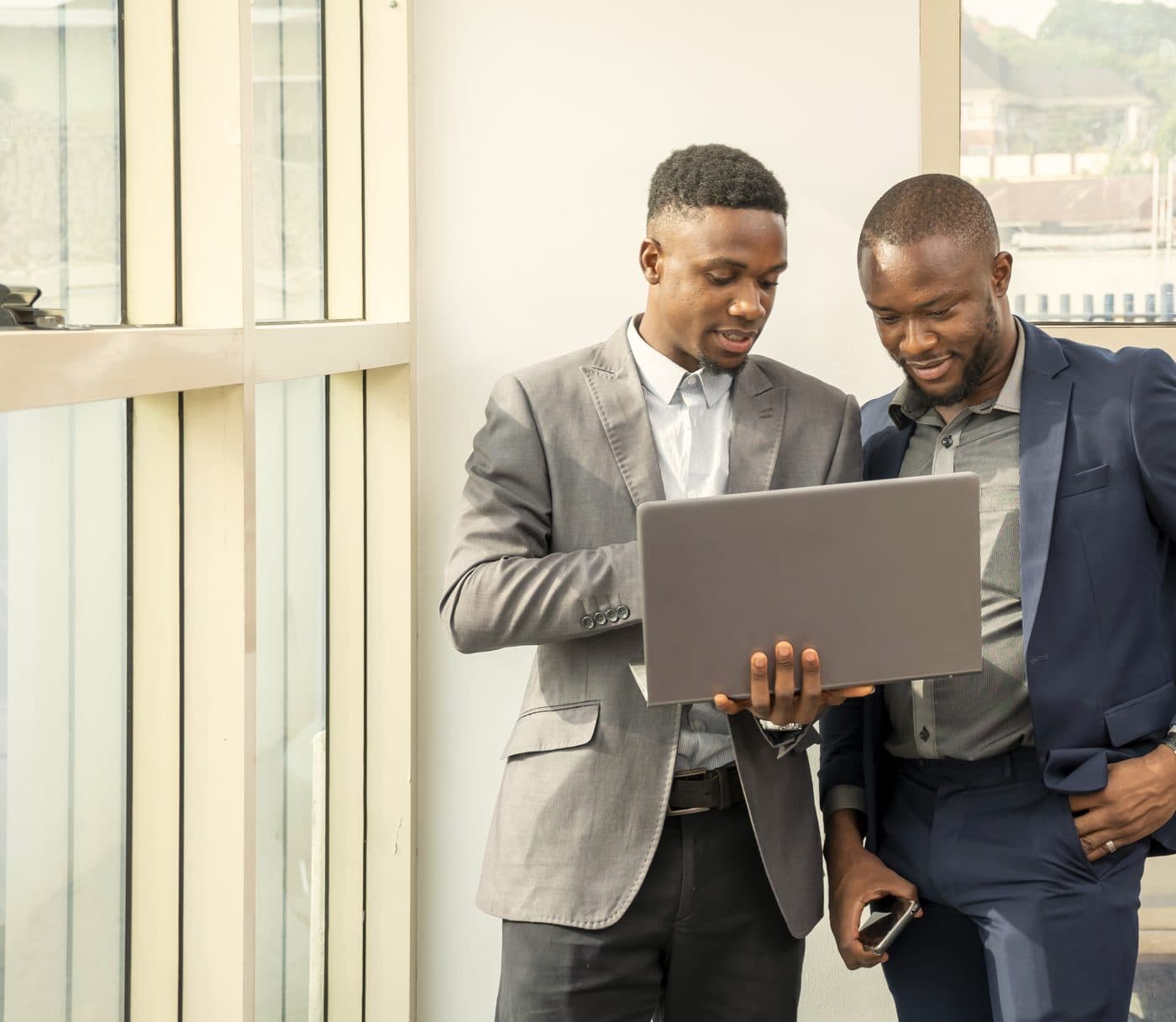 Two people shaking hands after a meeting